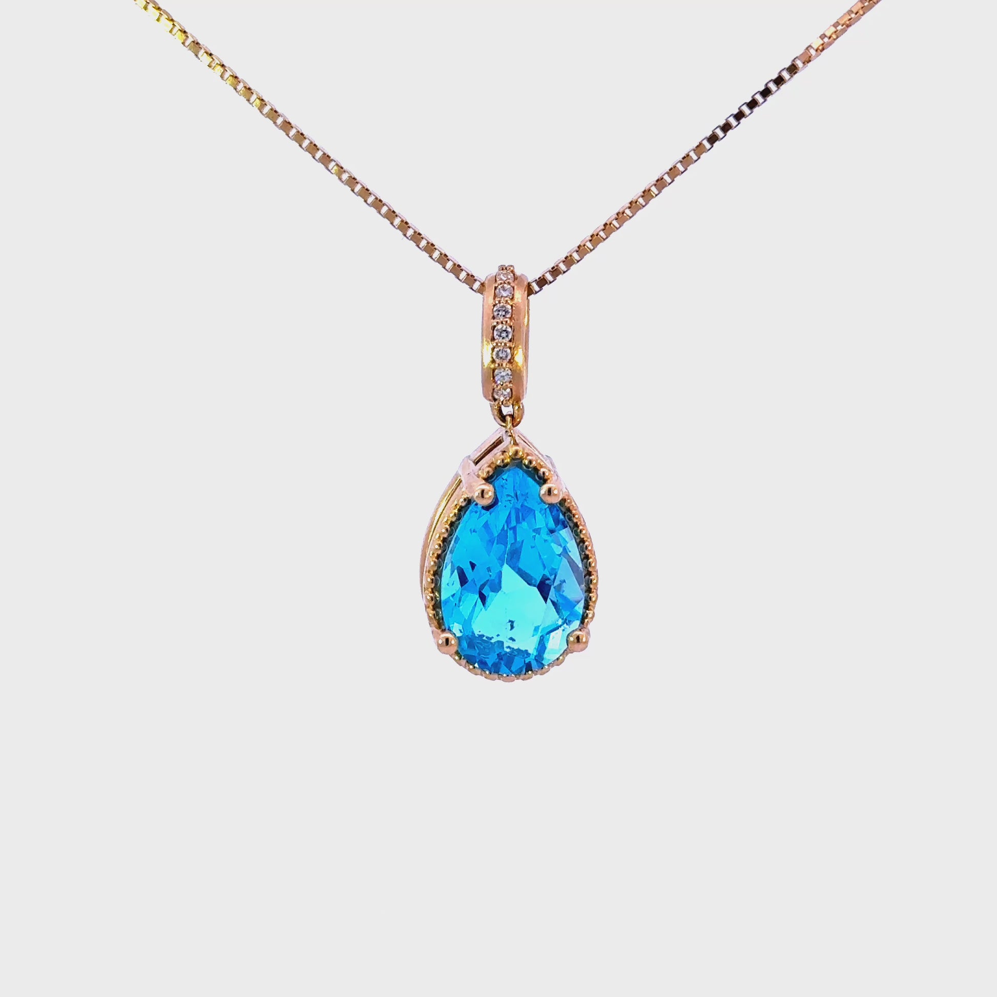 14k Pear London Blue Topaz Pendant